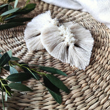 Load image into Gallery viewer, Uptown Pearl macramé earrings in colour Natural, green eucalyptus leaves on the left side of the picture.