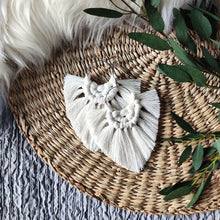 Load image into Gallery viewer, Natural white coloured Boho Babe macramé earrings, eucalyptus leaves on the right side of the picture.

