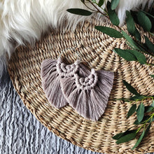 Load image into Gallery viewer, Sand coloured Boho Babe macramé earrings, eucalyptus leaves on the right side of the picture.
