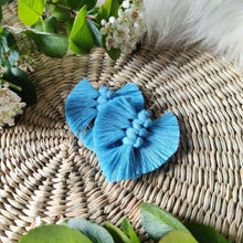 Load image into Gallery viewer, The Feather Babies macramé earrings in colour Beauxbatons, green leaves and flowers on the sides.
