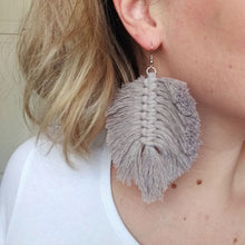 Load image into Gallery viewer, Model wearing The Feather Girls macramé earrings in colour Sand.
